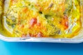 A dish of chicken and cheese is sitting in a baking tray Royalty Free Stock Photo