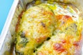 A dish of chicken and cheese is sitting in a baking tray Royalty Free Stock Photo