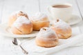 a dish of choux cream with a cup of tea or coffee for an afternoon break.