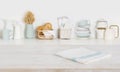Dish cloth on wooden table over defocused kitchen counter background Royalty Free Stock Photo