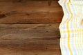 Dish cloth in yellow and white on brown wooden table Royalty Free Stock Photo