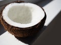 Dish Of Coconut Milk With A Split Fresh Coconut Royalty Free Stock Photo