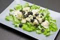 Dish of cod salad with black olives Royalty Free Stock Photo