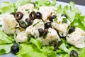Dish of cod salad with black olives Royalty Free Stock Photo