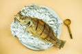 A dish of crispy Thai style deep fried whole sea bass fish Royalty Free Stock Photo