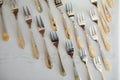 Dish decorated with gold forks layng on table