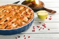 Dish with delicious apple pie on wooden background Royalty Free Stock Photo