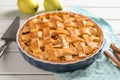 Dish with delicious apple pie on wooden background Royalty Free Stock Photo