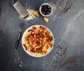 Dish of delicious cavatelli pasta with sausage, onion, parmesane and herbs. Top view Royalty Free Stock Photo