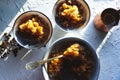 Dish for dessert with coffee ice, a bowl and grains on the table top view. Sicilian granite