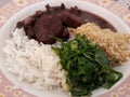 Dish with feijoada with farofa and cabbage Royalty Free Stock Photo