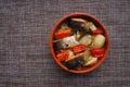 A dish of fish with vegetables. Royalty Free Stock Photo