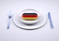 Dish with food supplement pill and german flag