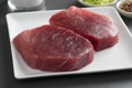 Dish with fresh raw yellowfin tuna steaks
