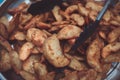 Dish with freshly cooked home french fries potato on table, toned Royalty Free Stock Photo