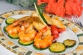 Dish: fried fish fillets, shrimp, zucchini Royalty Free Stock Photo