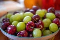 A dish of green grapes and cherries close-up Royalty Free Stock Photo