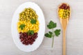 Dish with green peas, beans, sweet corn, parsley and spoon Royalty Free Stock Photo