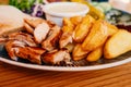 Dish with grilled chicken meat and fryed potato