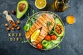 Dish grilled salmon steak with avocado and fresh vegetable salad. Keto diet concept healthy food, Healthy fats, clean eating for Royalty Free Stock Photo