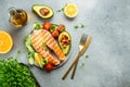 Dish grilled salmon steak with avocado and fresh vegetable salad. Keto diet concept healthy food, Healthy fats, clean eating for Royalty Free Stock Photo