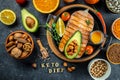 Dish grilled salmon steak with avocado and fresh vegetable salad. Keto diet concept healthy food, Healthy fats, clean eating for Royalty Free Stock Photo