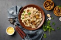 A dish of Italian cuisine - risotto from rice and mushrooms Royalty Free Stock Photo