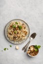 A dish of Italian cuisine - risotto from rice and mushrooms. Top view. Royalty Free Stock Photo