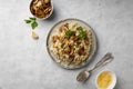 A dish of Italian cuisine - risotto from rice and mushrooms. Royalty Free Stock Photo