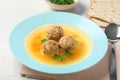 Dish of Jewish matzoh balls soup on wooden table Royalty Free Stock Photo