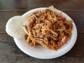 Dish of lechona, a traditional food from espinal, tolima, Colombia over a wood table