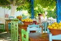 A dish of lemons in typical greek outdoor cafe