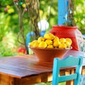 A dish of lemons in typical greek outdoor cafe
