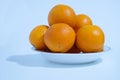 Dish with lots of oranges on one white. Royalty Free Stock Photo