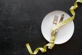 Dish and measuring tape concept diet with copy space Royalty Free Stock Photo