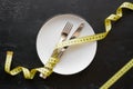 Dish and measuring tape concept diet Royalty Free Stock Photo