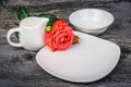 Dish, milk jug and rose Royalty Free Stock Photo