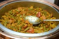 A dish mixed of curry and sliced long beans, corn, carrot, tomato and onions Royalty Free Stock Photo