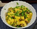 A dish named as khandvi famous in Maharashtra usually served with onion leaves