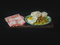 a dish of nasi goreng hijau, a traditional Indonesian green chili fried rice on black background Royalty Free Stock Photo