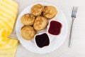 Dish with oat pancakes, blueberry jam, strawberry jam, napkin, f Royalty Free Stock Photo