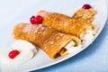 Dish of pancakes palachinki with filling from brynza and walnuts Royalty Free Stock Photo