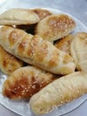 A dish of pastries with sesami seeds