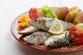 Dish of portuguese sardines on a table