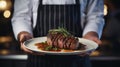 dish in a restaurant steak meat in the hands