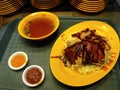 Dish of rice with roast duck and soup in a typical Singapore food court or Hawker Royalty Free Stock Photo