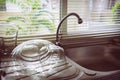 Dish sink in kitchen room Royalty Free Stock Photo