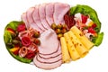 Dish with sliced smoked ham, salami rolls. Royalty Free Stock Photo