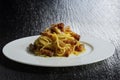 Plate with spaghetti carbonara on black stone Royalty Free Stock Photo