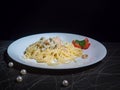 Dish of Spaghetti Carbonara Shrimp on wood background Royalty Free Stock Photo